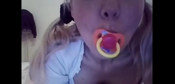  how nice to be a baby ! pacifier, diaper and lollipop and a wet little thing to be discovered